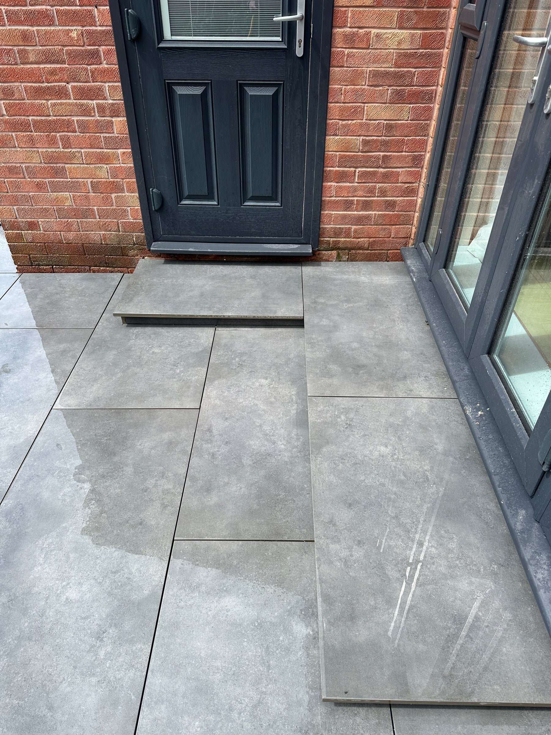 Porcelain and natural stone finishes by JJN Construction in Somerset