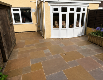 Natural stone patio detail by JJN Construction
